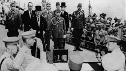 2nd September 1945:  Sir Arthur Percival and Jonathan Wainwright salute General Douglas MacArthur (1880 - 1964) as Supreme Commander of the Allied Forces just before he accepts the Japanese unconditional surrender document. Mamoru Shigemitsu, the top-hatted foreign minister, along with General Yoshijiro Umezu, the army chief of staff, lead the Japanese delegaation, on board the USS Missouri in Tokyo Bay.  (Photo by Keystone/Getty Images)
