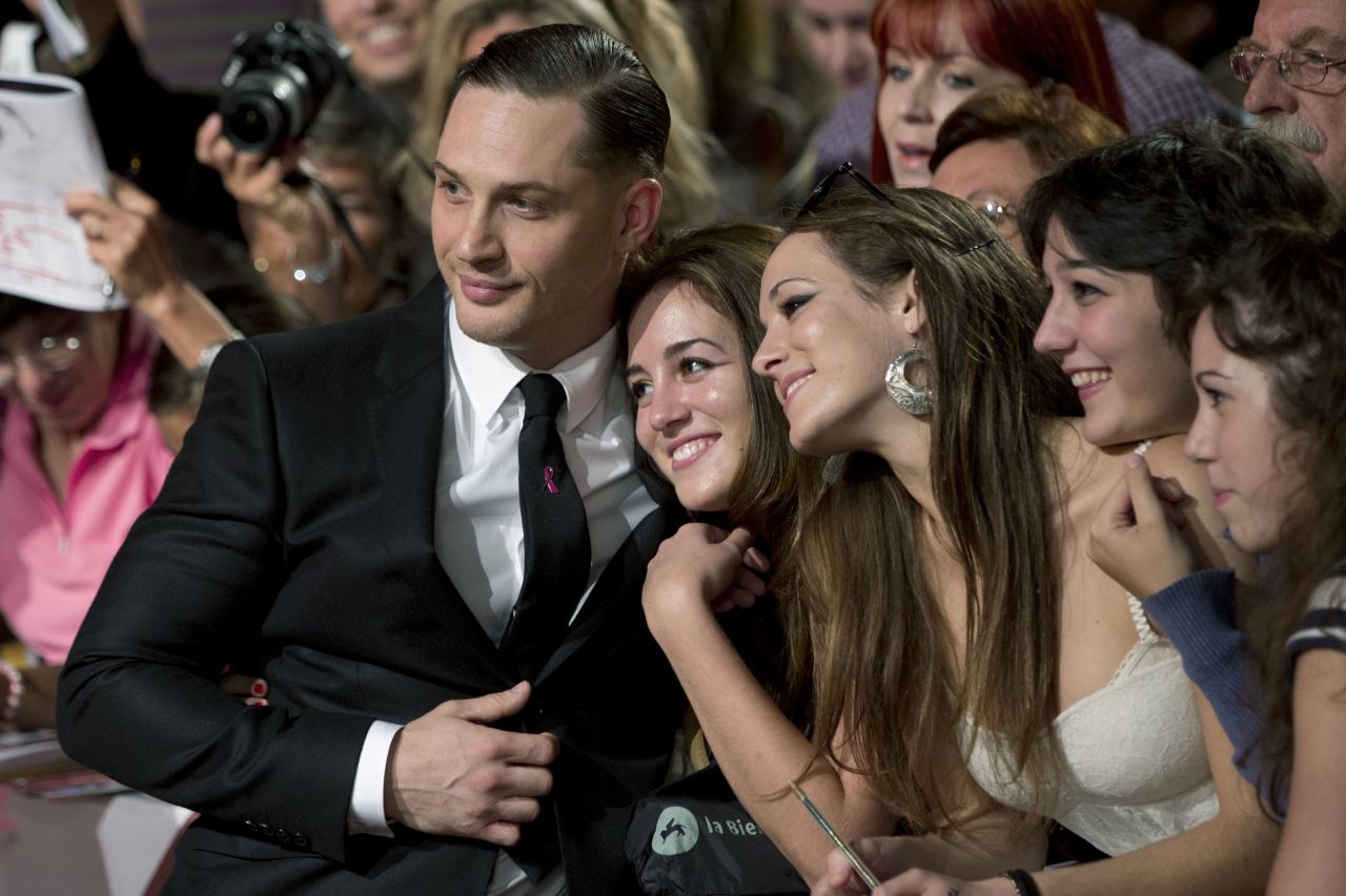 Actor Tom Hardy poses with fans on the red carpet for the film "Locke" at the Venice Film Festival on September 2.