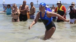 Image #: 24144968    U.S. long-distance swimmer Diana Nyad , 64, walks to dry sand, completing her swim from Cuba as she arrives in Key West, Florida, September 2, 2013. Nyad has become the first person to swim from Cuba without a shark cage. REUTERS/Andrew Innerarity  (UNITED STATES - Tags: SPORT SWIMMING TPX IMAGES OF THE DAY)       REUTERS /Andrew Innerarity /LANDOV