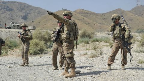 US soldiers gather after a clash between Taliban and Afghan security forces in Torkham on Monday.