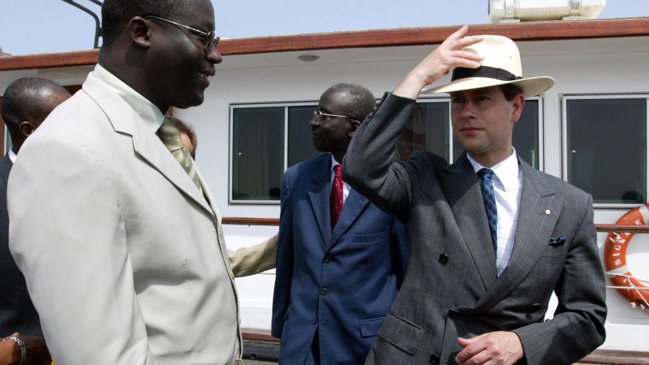 The youngest son of Britain's Queen Elizabeth II, Prince Edward, right, is greeted by Goree Island Mayor Augustin Senghore upon his arrival at Goree Island, Senegal, on June 6, 2004.