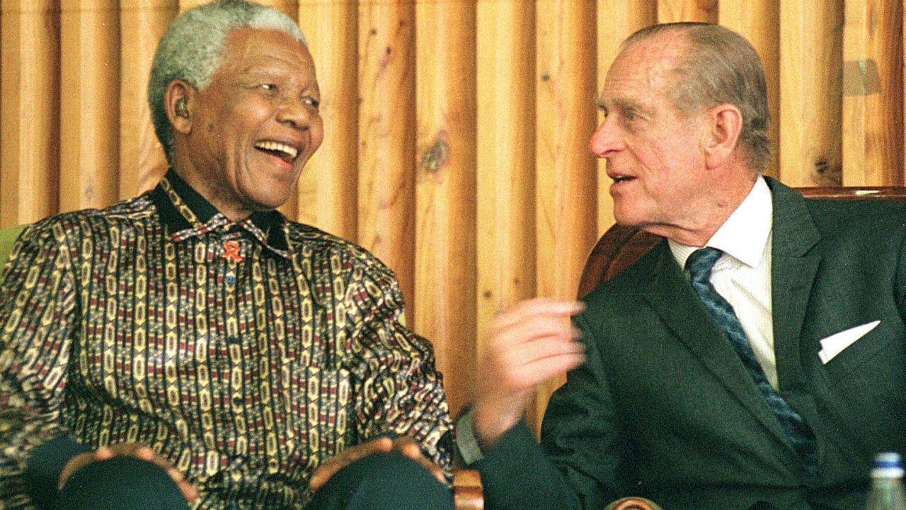 Former South African President Nelson Mandela chats with Prince Philip during an awards ceremony for juvenile prisoners at Drakenstein prison outside Cape Town, South Africa, on November 5, 2000. 