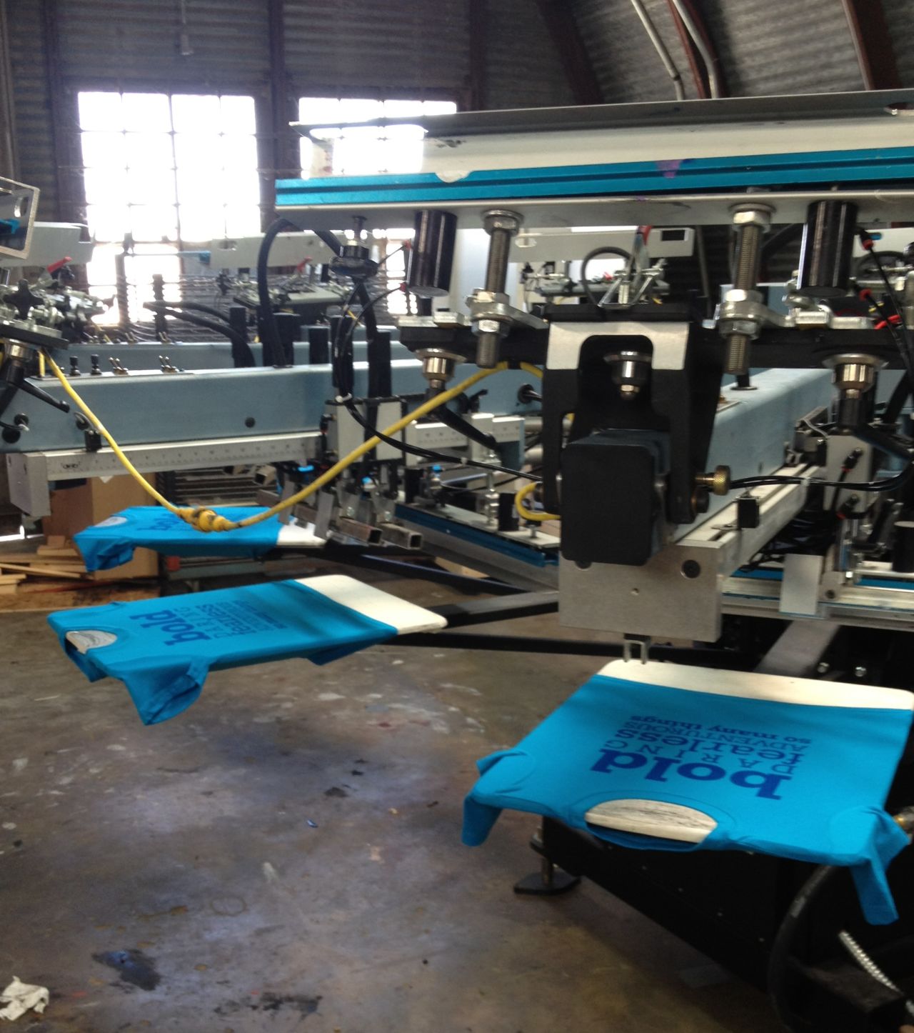 Graphics are printed on Girls Will Be T-shirts by Kong Screenprinting in Austin, Texas. 