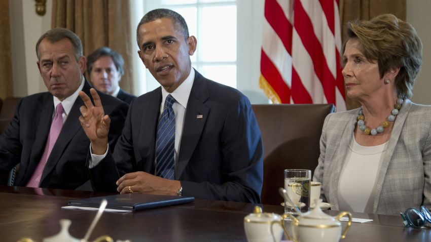 President Barack Obama, flanked by House Speaker John Boehner of Ohio, left, and House Minority Leader Nancy Pelosi of Calif., speaks to media in the Cabinet Room of the White House in Washington, Tuesday, Sept. 3, 2013, before a meeting with members of Congress to discuss the situation in Syria. (AP Photo/Carolyn Kaster)