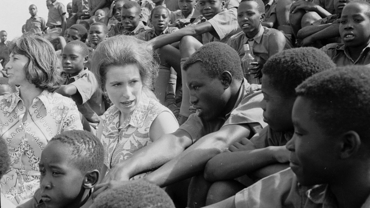 Princess Anne sits with a group of Kenyan orphans as they watch a soccer match at Starehe Boys' Centre in Nairobi, Kenya on February 8, 1971.