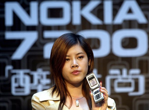 A Nokia mobile phone is displayed at a promotion in Beijing on May 6, 2004. Late Monday, Microsoft announced it was buying Nokia's mobile phone division, further sealing a partnership the two companies have had since 2011.