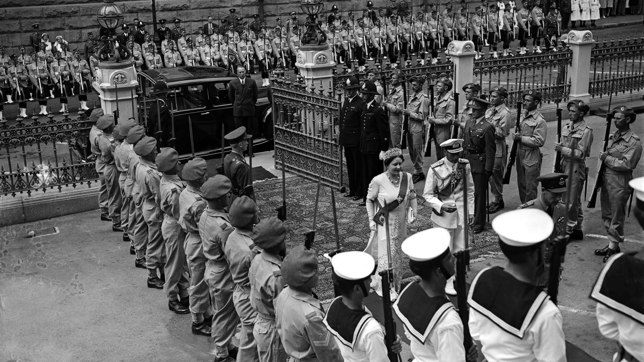 King George VI and Queen Elizabeth arrive at the Senate House in Cape Town, South Africa, where the king opened Parliament on February 26, 1947.
