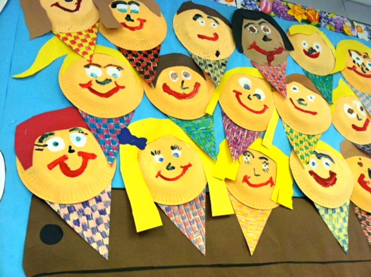 In kindergarten, C.J. created a paper version of himself with "red hair and luscious lashes." His project is in the lower left corner.