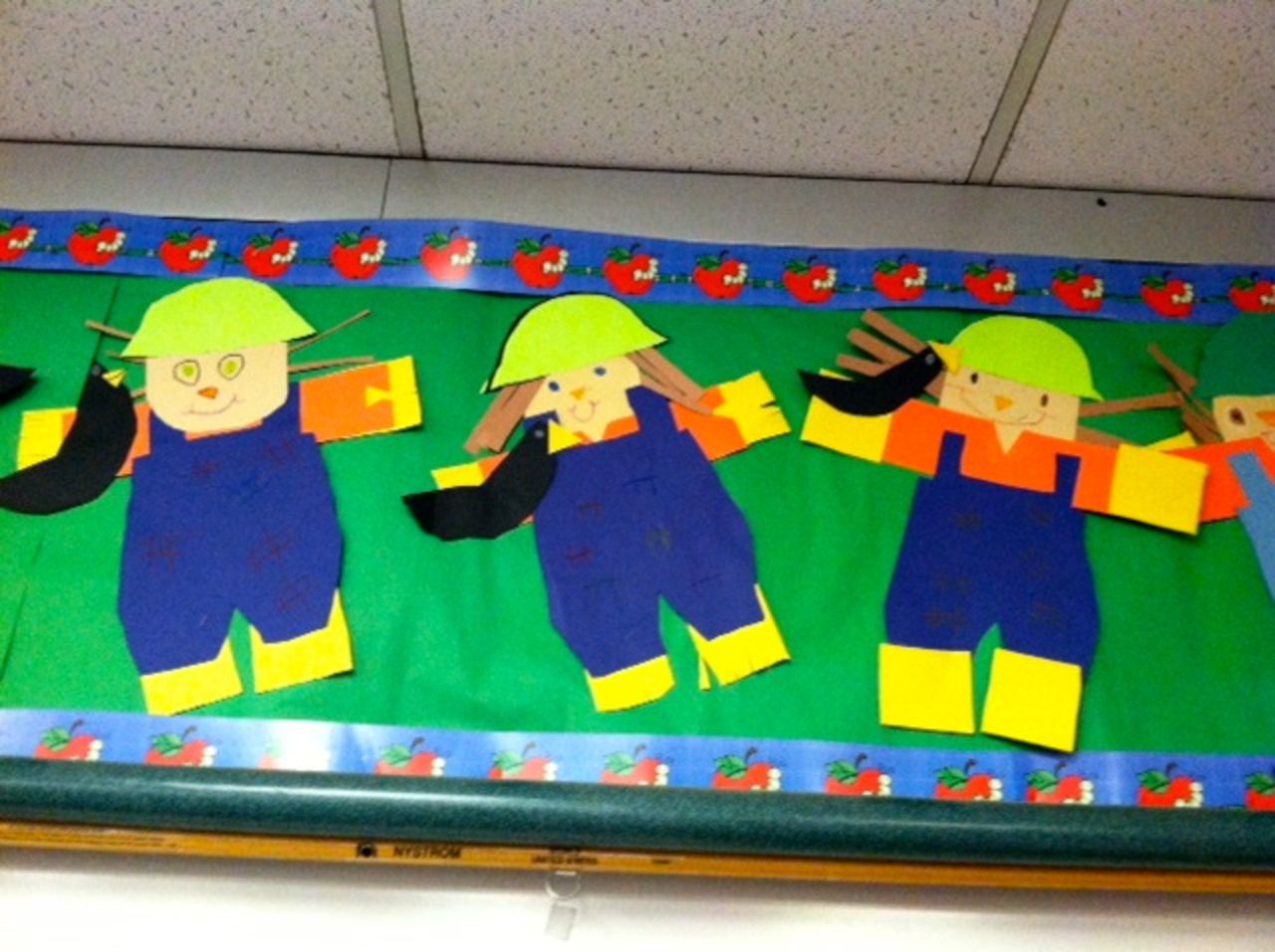 C.J. made a long-haired version of himself -- the paper farmer in the middle -- during "Going To The Farm" week in kindergarten.