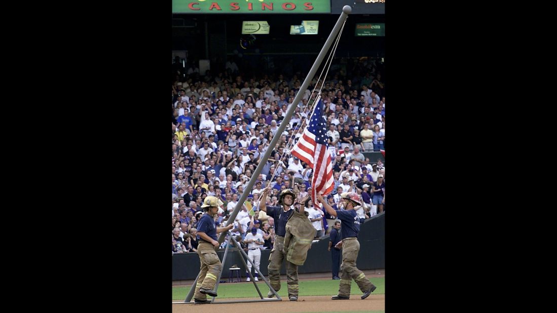 Firemen re-create the flag raising during the 2001 World Series in Phoenix, Arizona, on October 27, 2001.
