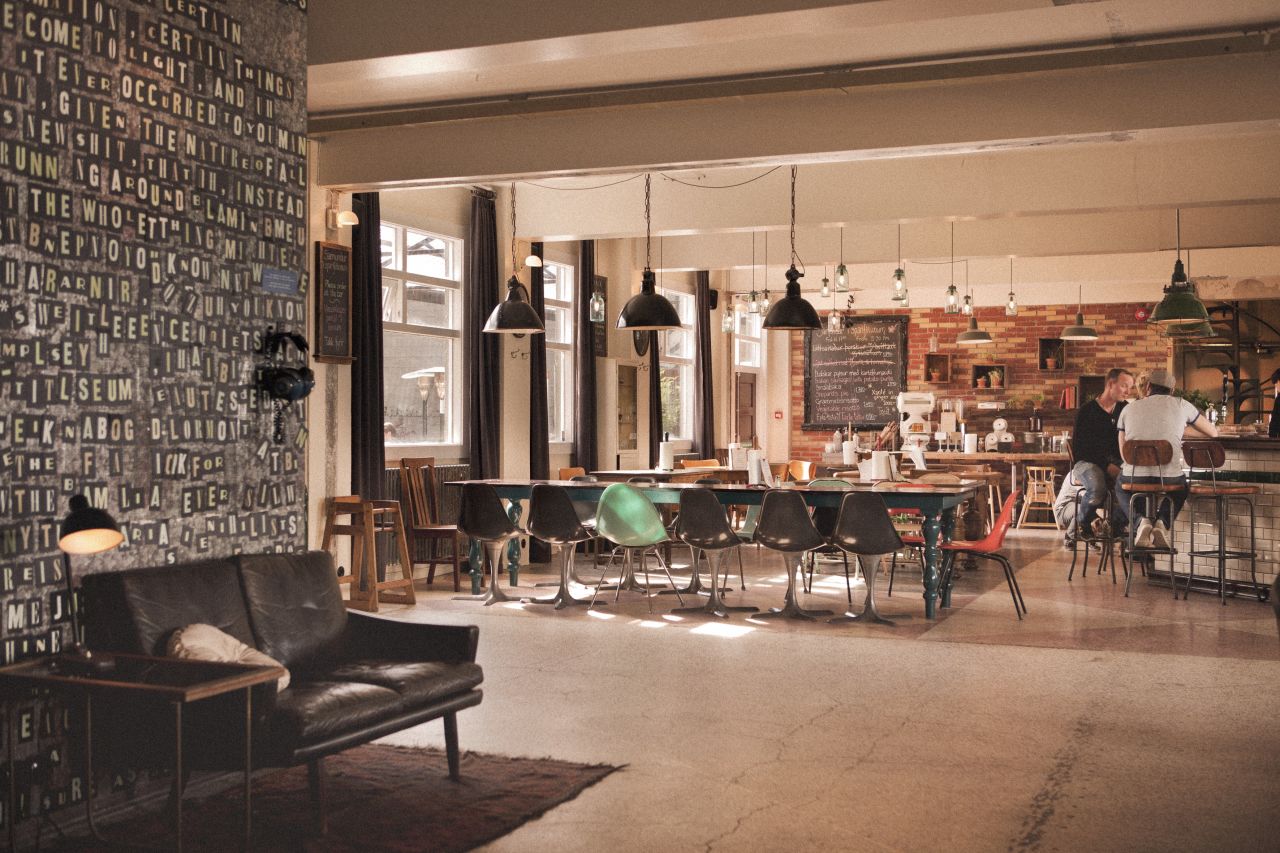 Locals and travelers can hang out and have beer in this hostel inside an old biscuit factory.