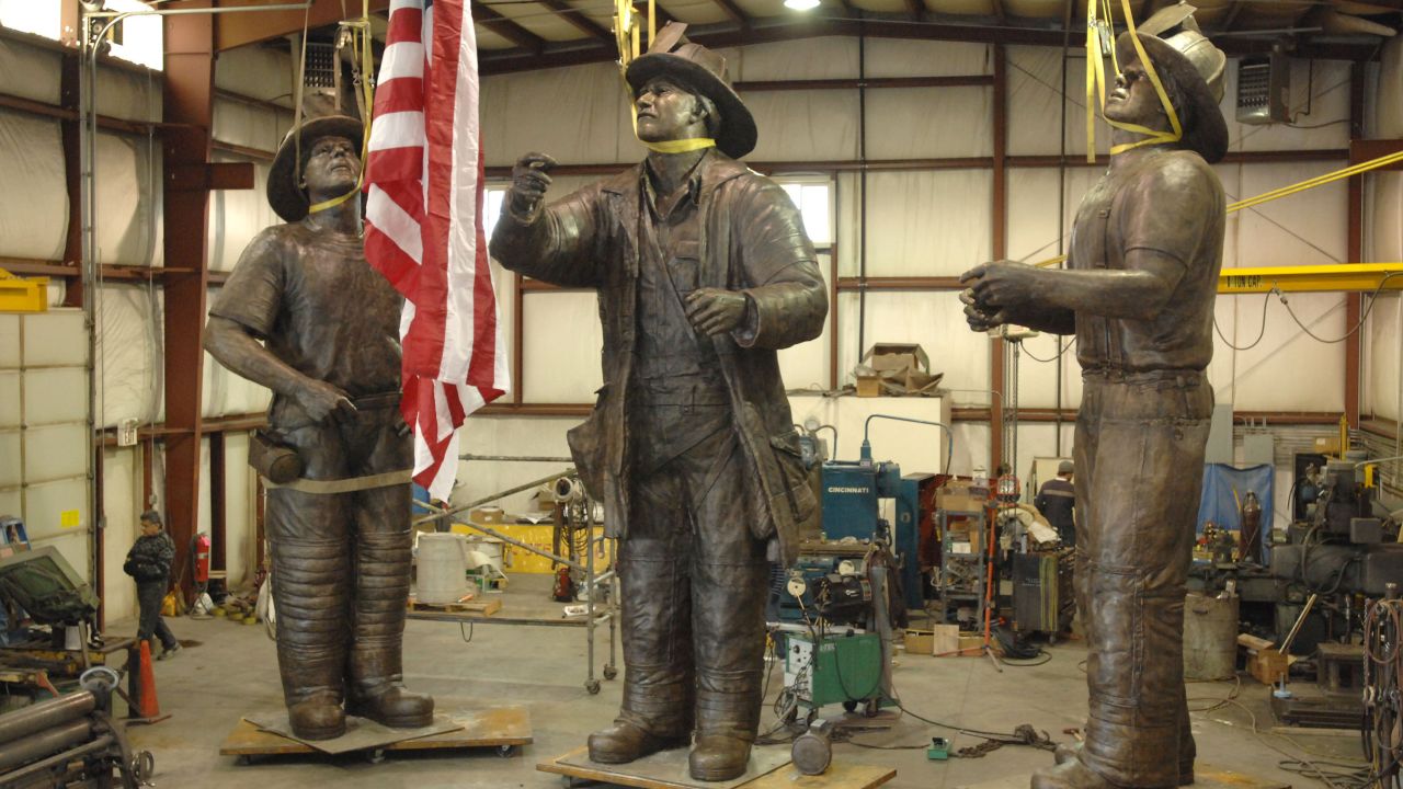 A 40-foot-tall bronze monument named "To Lift a Nation" depicts the famous scene. Pictured at a warehouse in 2007, the sculpture is now part of the permanent collection at the National Fallen Firefighters Memorial Park in Emmitsburg, Maryland.