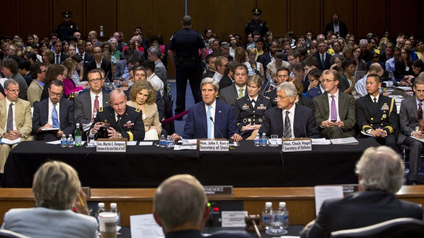 Army Gen. Martin Dempsey, chairman of the Joint Chiefs of Staff, left, Secretary of State John Kerry, center, and Defense Secretary Chuck Hagel testify on the potential use of U.S. military force in Syria during a hearing before the Senate Foreign Relations Committee in Washington, D.C., Sept. 3, 2013.
