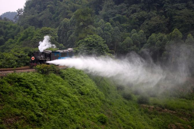 A chartered tourist train lets off steam at the Jiaoba Curve. The Jiayang Railway makes a great addition to the well-established local itinerary of Emei Mountain and Leshan Big Buddha.