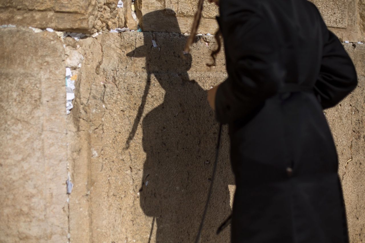 A young man prays at the Western Wall on September 4. Jewish people in Israel welcomed the new year late Wednesday despite turmoil brewing on the country's borders in Egypt and especially Syria.