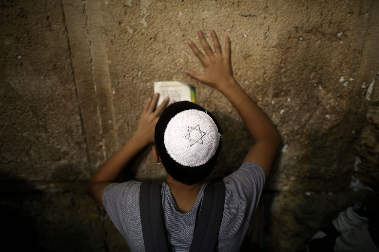 A young Jewish boy prays for forgiveness and mercy at the Western Wall on September 4.