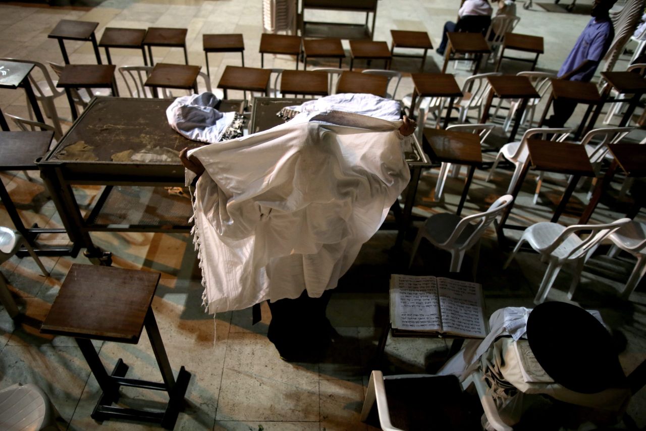 An Orthodox Jewish man prays under a shawl on September 4 in Jerusalem's Old City.