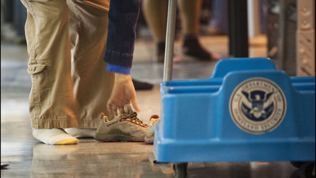 Airport security personnel are considered essential and will continue working through the shutdown. So if you fly, there will be someone there to ask you to remove your shoes.  (File photo) 