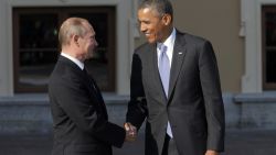 Russia's President Vladimir Putin, left, shakes hands with U.S. President Barack Obama during arrivals for the G-20 summit at the Konstantin Palace in St. Petersburg, Russia on Thursday, Sept. 5, 2013. The threat of missiles over the Mediterranean is weighing on world leaders meeting on the shores of the Baltic this week, and eclipsing economic battles that usually dominate when the G-20 world economies meet. (AP Photo/Dmitry Lovetsky)
