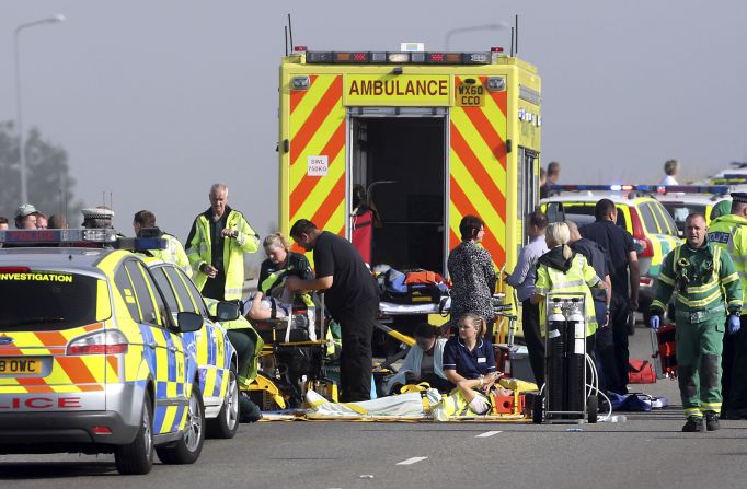 Injured people are treated on the road. 