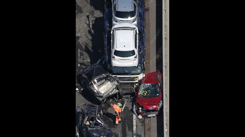 An aerial shot of the bridge shows crushed cars.