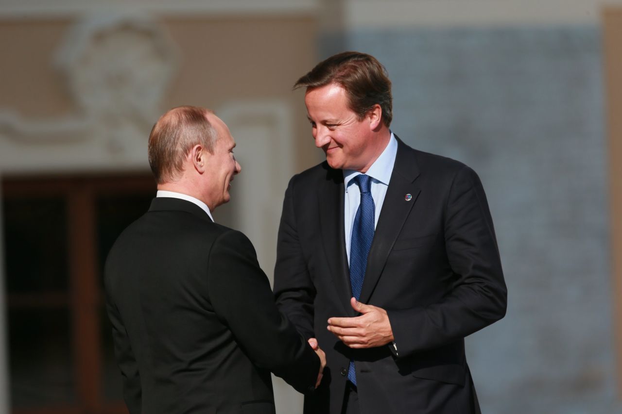 Russian President Vladimir Putin, left, and British Prime Minister David Cameron shake hands during an official welcome of G-20 heads of state and government at the Konstantin Palace in St. Petersburg.