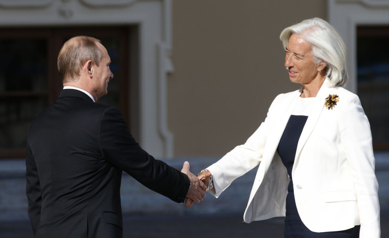 Putin, left, shakes hands with Christine Lagarde, managing director of the International Monetary Fund, during arrivals for the G-20 summit.