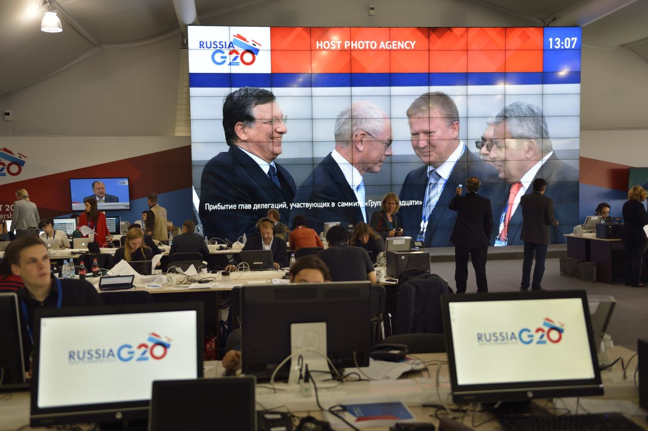 The arrival of European Commission President Jose Manuel Barroso and European Council President Herman Van Rompuy is shown on a giant screen in the main press center prior to the G-20 summit on September 5.
