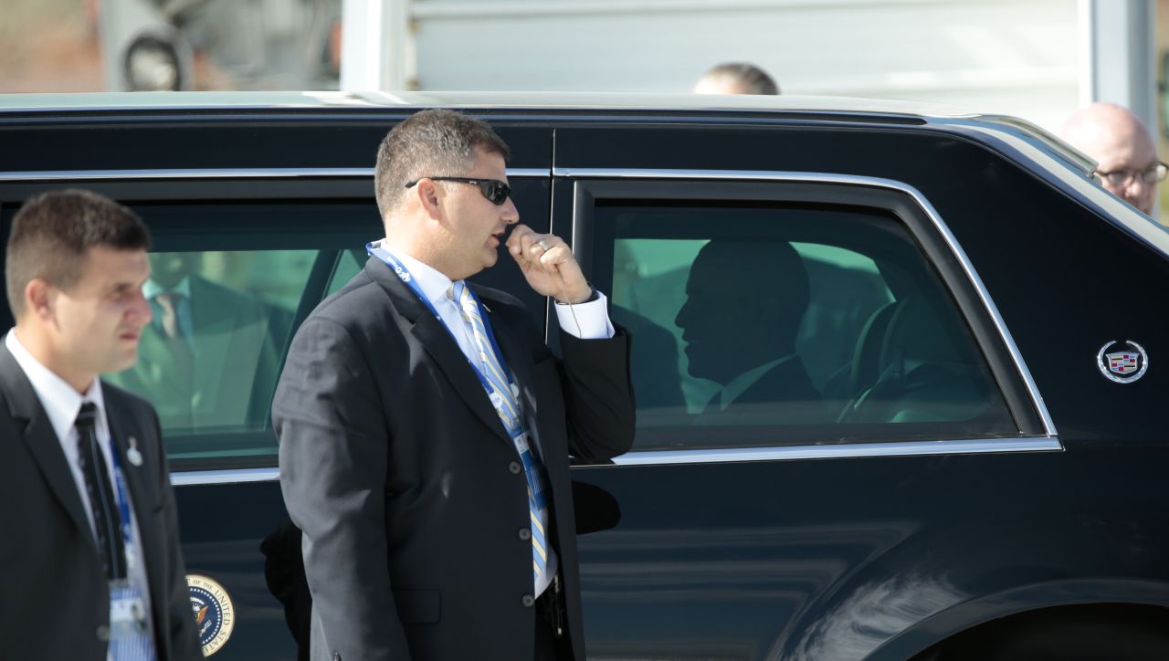 A security detail surrounds his limo as U.S. President Barack Obama arrives for the G-20 summit on September 5.