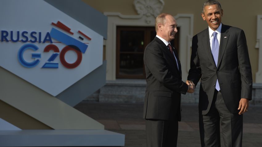 Russias President Vladimir Putin (L) welcomes US President Barack Obama at the start of the G20 summit on September 5, 2013 in Saint Petersburg. Russia hosts the G20 summit hoping to push forward an agenda to stimulate growth but with world leaders distracted by divisions on the prospect of US-led military action in Syria.                AFP PHOTO / ERIC FEFERBERG        (Photo credit should read ERIC FEFERBERG/AFP/Getty Images)