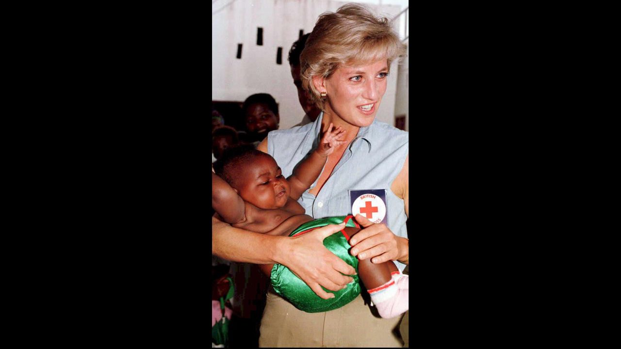 Princess Diana holds one of the many babies at the Kikolo health post during a visit to Luanda, Angola, on January 14, 1997.
