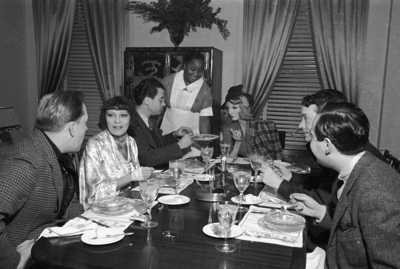 Sunday brunch at novelist Thyra Samter Winslow's Park Avenue home in 1937. Cynthia sits at center.