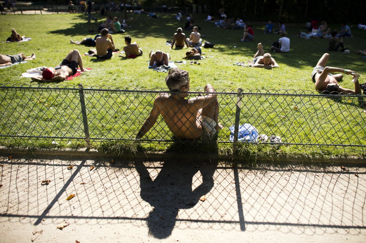 People enjoy the sun in a public park in Paris on Thursday, September 5. Look at other images of weather from around the world.