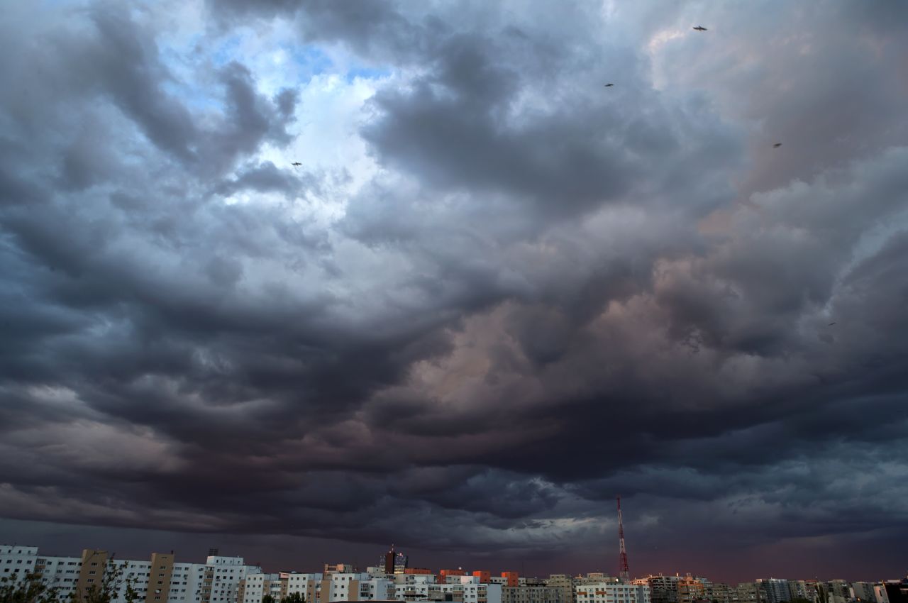 Clouds are illuminated by the setting sun in Bucharest, Romania, on September 3.