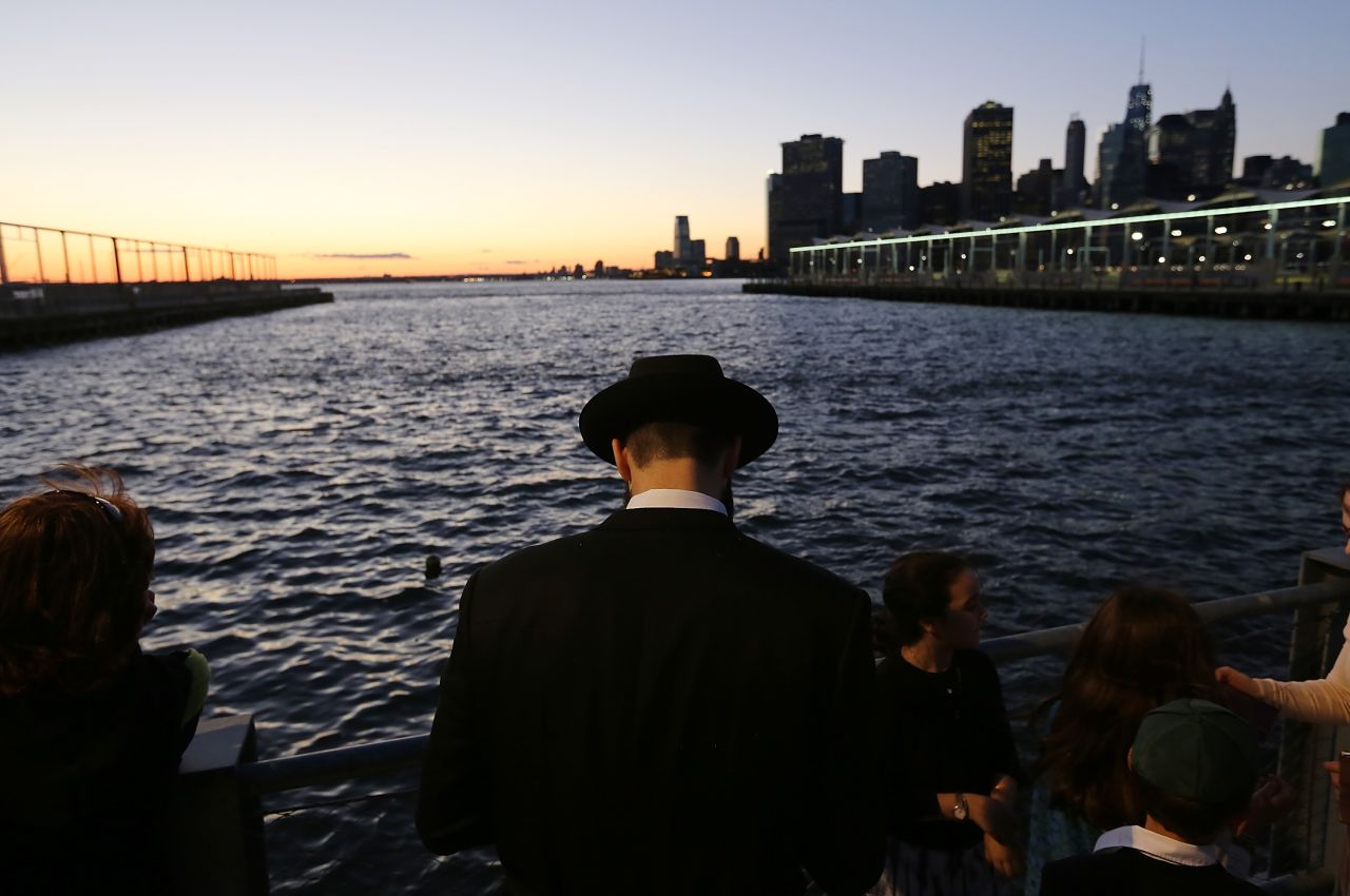 An Orthodox Jewish man marks Rosh Hashanah at Brooklyn Bridge Park during a traditional Tashlich ceremony in the Brooklyn borough of New York on Thursday, September 5. Rosh Hashanah, the Jewish New Year, started at sundown Wednesday and runs through Friday. It is a time for reflection and repentance that leads up to Yom Kippur, the day of atonement.