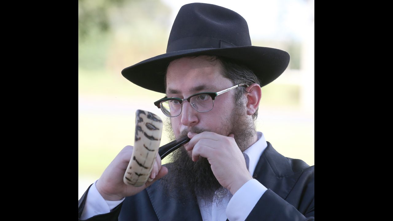 Rabbi Yossi Hecht blows the shofar during a ceremony in Ocala, Florida, on September 5. Hecht held the Tashlich (to cast) for people to cast their sins out over the water in order to start the new year with no sins. 