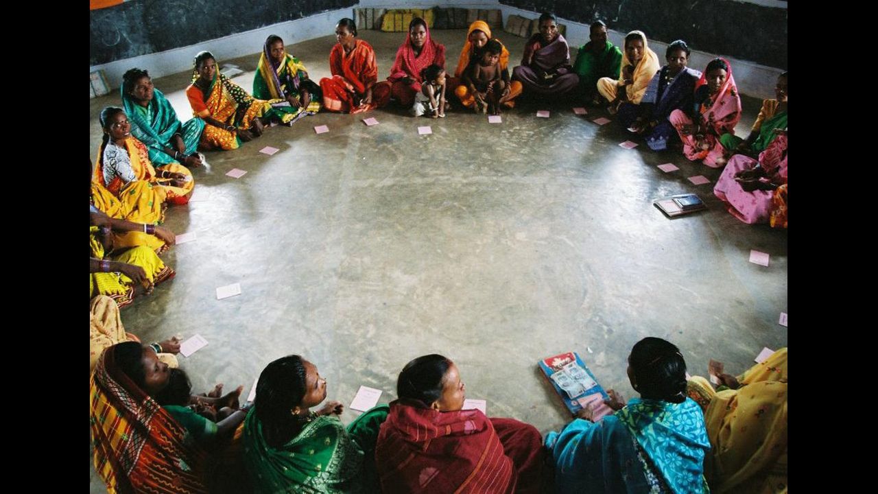 Members of a self-help group organized by Gram Vikas meet in Mohulpalli village in the Bargarh district of Orissa, India. Gram Vikas is a nongovernmental organization that was drawn to Orissa in the 1970s to help communities that had been ravaged by a cyclone. Executive Director Joe Madiath originally focused on providing renewable energy for rural communities, building more than 54,000 biogas units. Over time, the group has championed a more holistic model of development, based on Madiath's conviction that healthy living practices and improved quality of life are necessary before total development can occur.