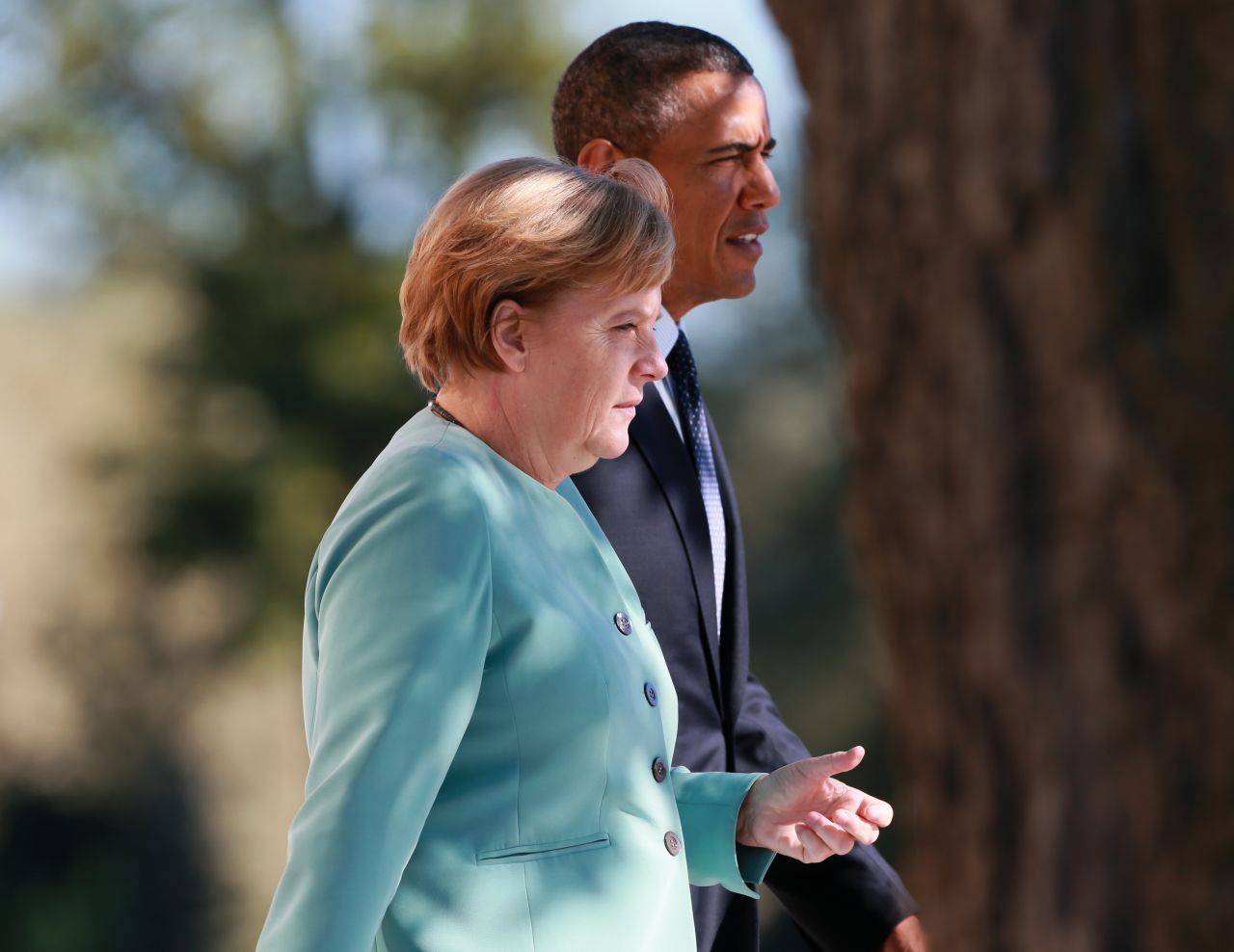 President Barack Obama and German Chancellor Angela Merkel arrive to pose with other leaders for a group photo during the G-20 Summit on September 6.