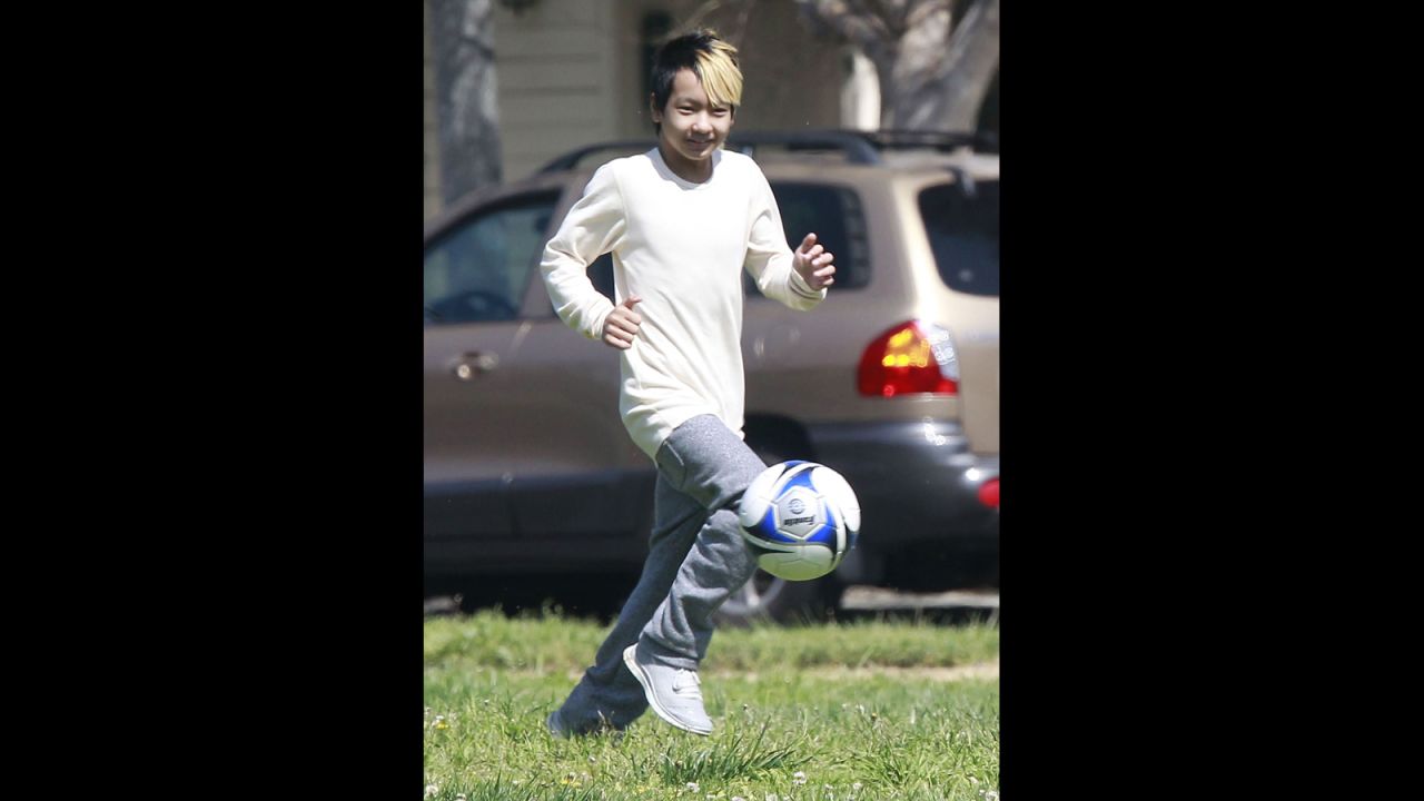 In March 2013, a soon-to-be 12-year-old Maddox played soccer with friends in a park. 