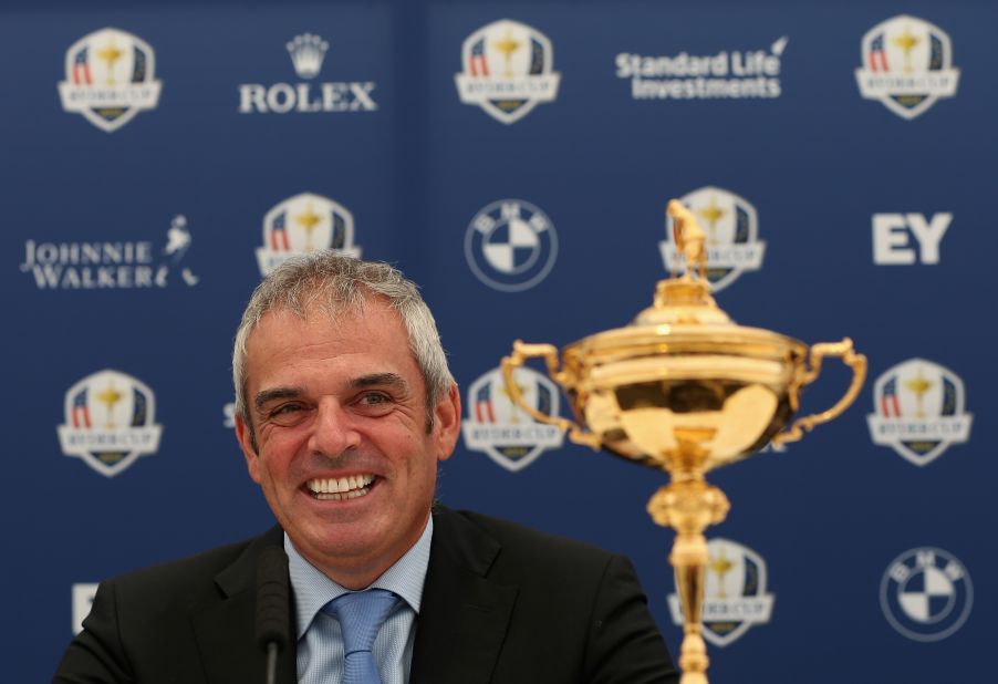 McGinley, the European captain for 2014, is all smiles as he parades the Ryder Cup ahead of next year's title defense in Scotland.