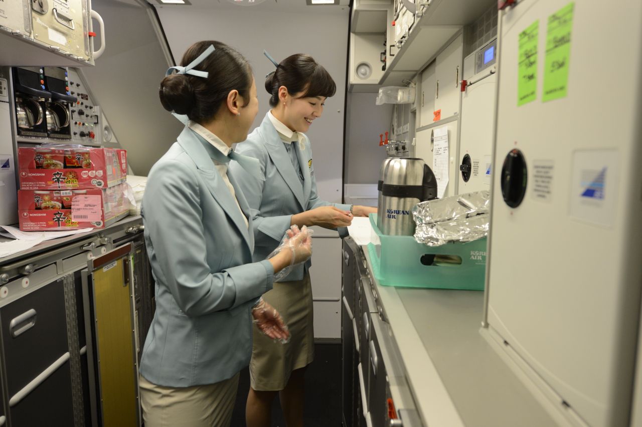 Korean Airlines flight attendants prepare for the return flight to Seoul in one of the A380's galleys.