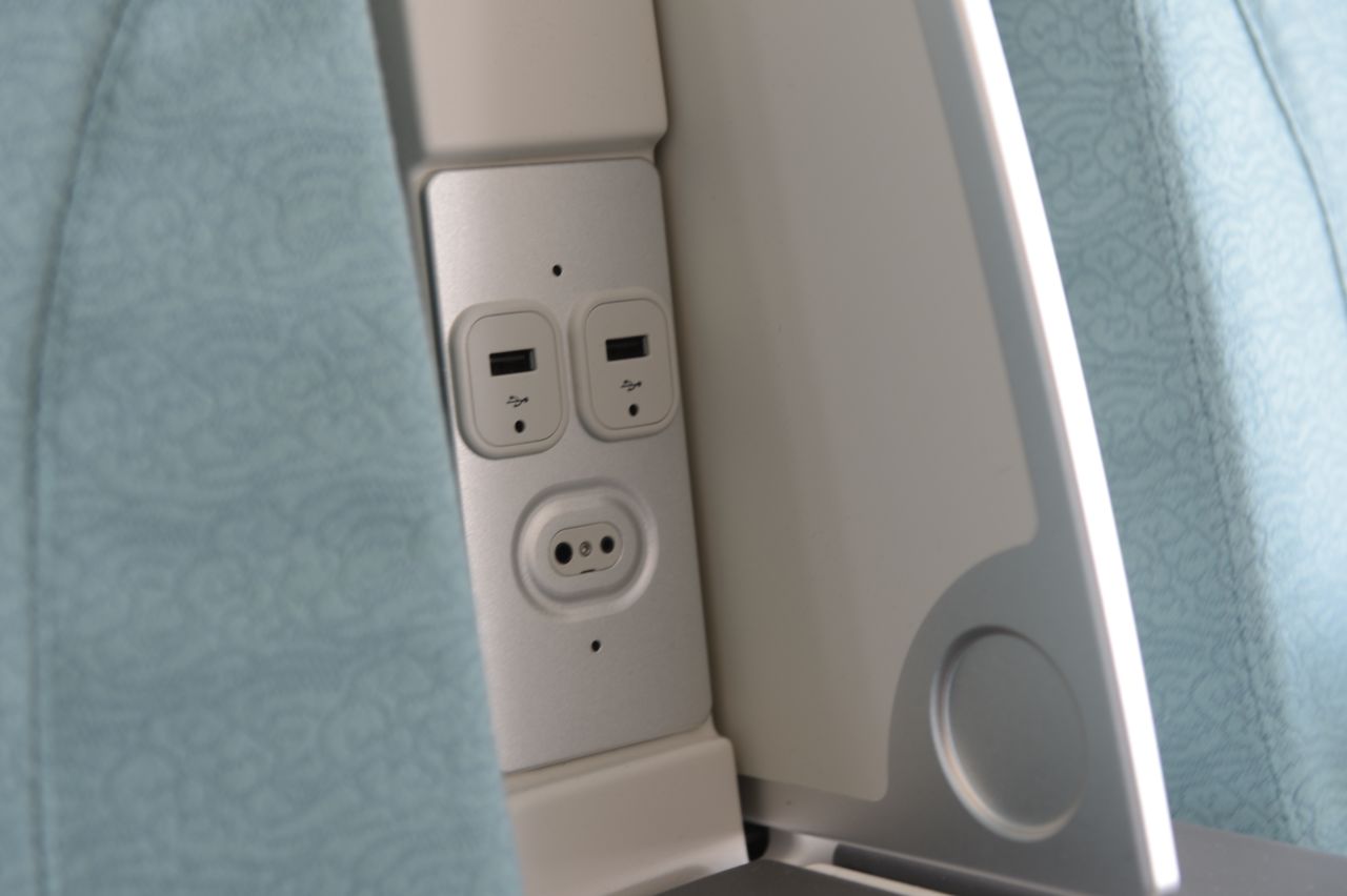 Convenient power and data ports have been inserted between the seats.