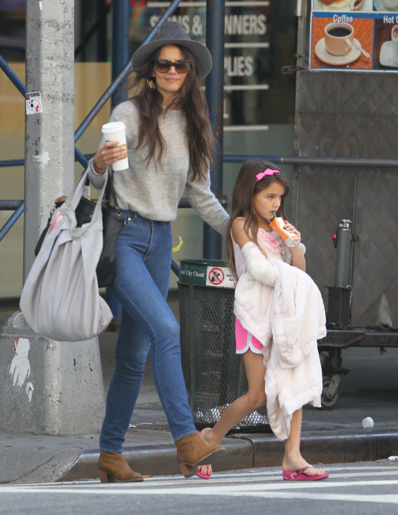 Suri Cruise keeps a strong grip on her juice box and blanket while out with mom Katie Holmes on September 5. 