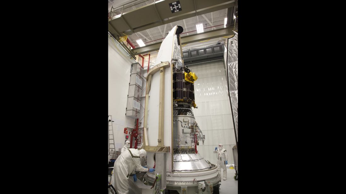 NASA engineers at the Wallops Flight Facility in Virginia load the spacecraft into the rocket's nose-cone. LADEE is the first spacecraft designed, developed, built and tested at NASA's Ames Research Center in Moffett Field, California.