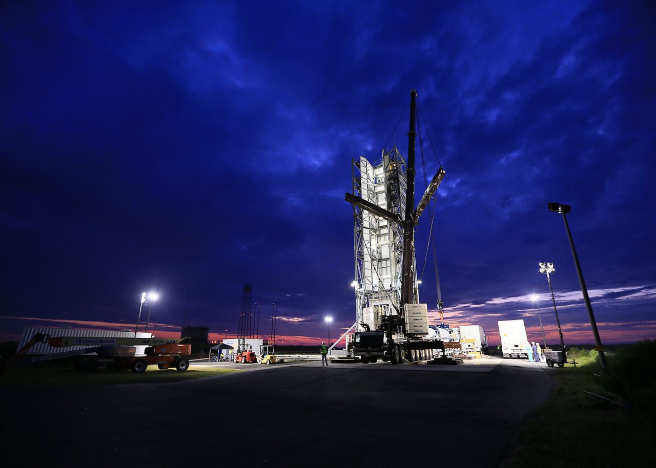 Engineers prepare to put the rocket into place.