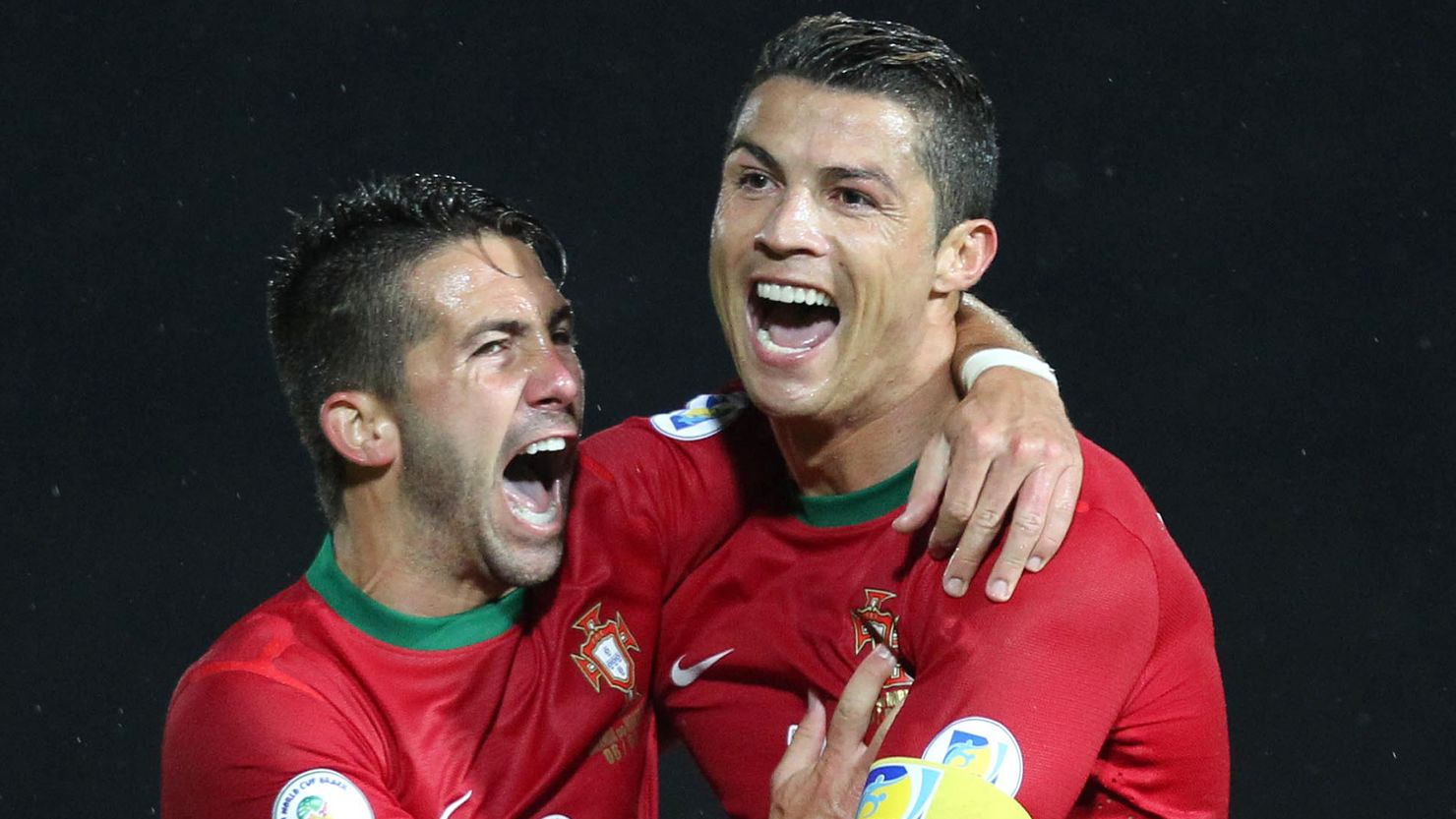 Portugal's Cristiano Ronaldo (right) celebrates scoring his second goal against Northern Ireland at Windsor Park in Belfast.