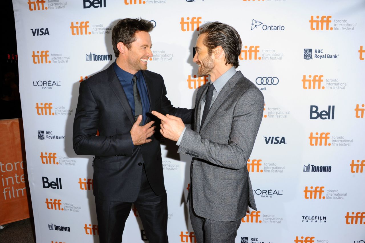 Hugh Jackman, left, and Jake Gyllenhaal  arrive at the premiere of "Prisoners" at the Elgin Theatre on September 6.