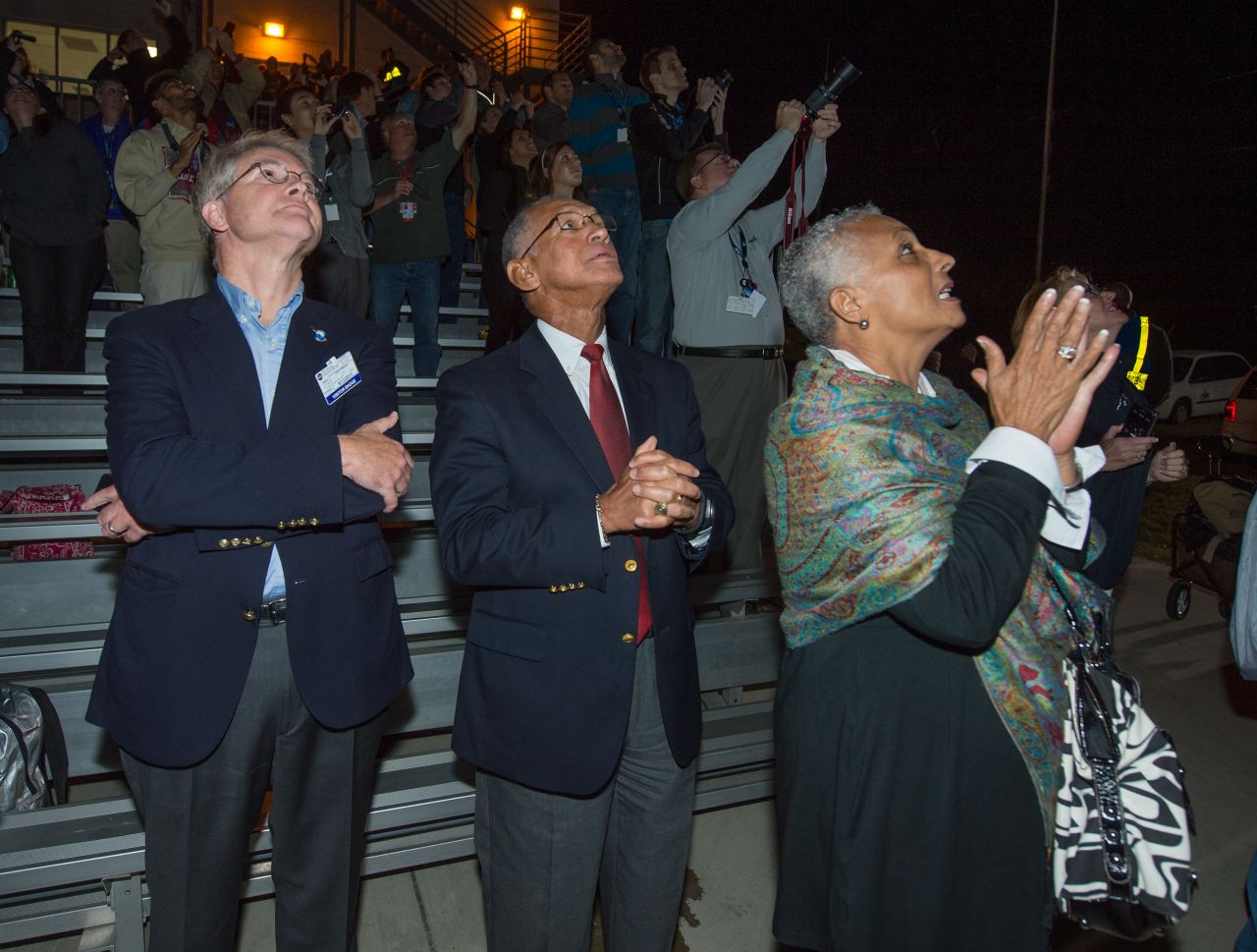 David W. Thompson, chairman and CEO of Orbital Sciences, left, NASA Administrator Charles Bolden and Mrs. Jaqueline Bolden watch the launch on September 6.