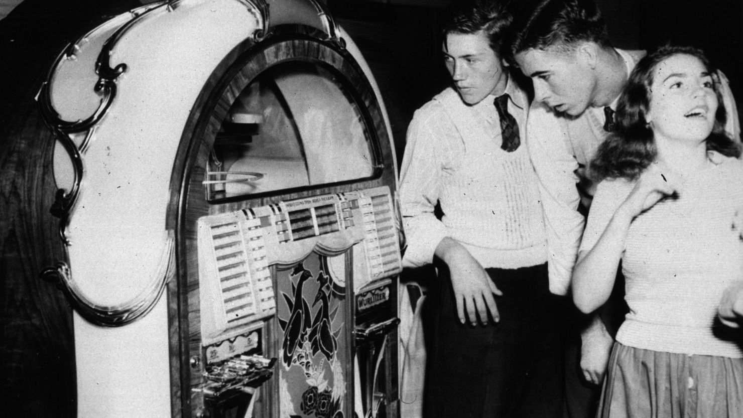 Teenagers stand by a jukebox in a dance hall in Richwood, West Virginia in September, 1942.