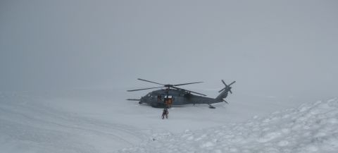 The Alaska Air Guard Rescue team arrives to scoop up the stranded team on Friday.